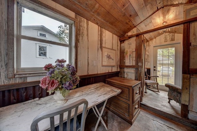 interior space featuring wooden walls, lofted ceiling, light hardwood / wood-style floors, and wooden ceiling