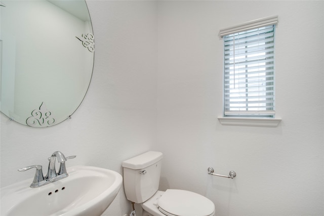 bathroom with sink and toilet