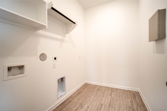 laundry area featuring hookup for a washing machine, hookup for an electric dryer, gas dryer hookup, and hardwood / wood-style flooring