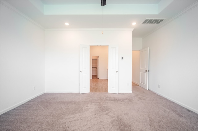 interior space featuring light carpet, crown molding, and ceiling fan