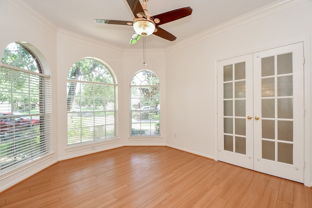 empty room with light hardwood / wood-style flooring, ceiling fan, and ornamental molding