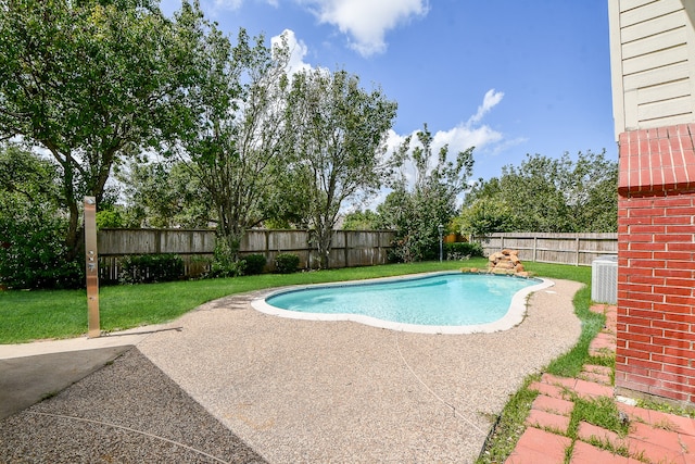 view of swimming pool with a lawn and a patio area