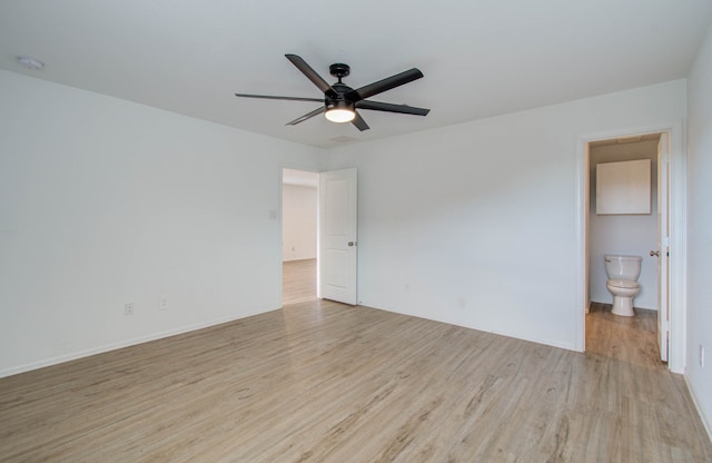 empty room with ceiling fan and light hardwood / wood-style floors