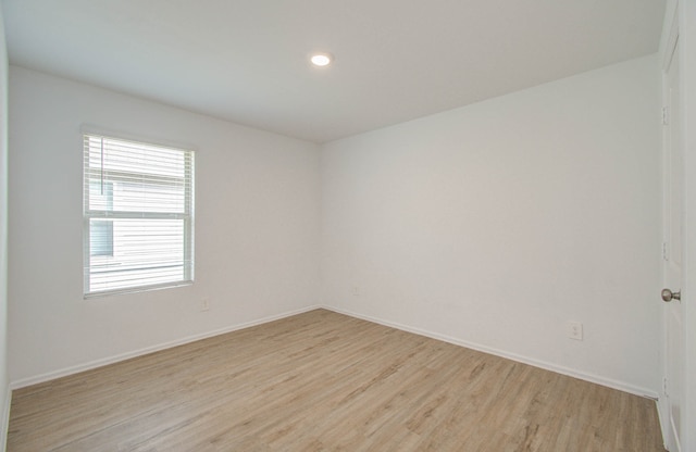 empty room with light hardwood / wood-style floors