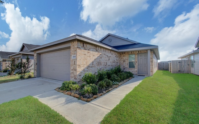 single story home with a front yard and a garage