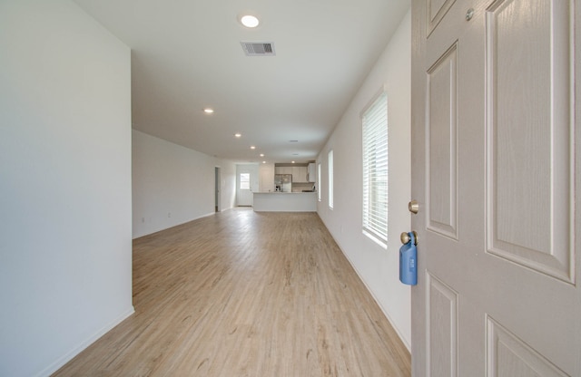 unfurnished living room with light hardwood / wood-style flooring