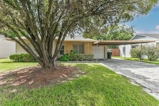 ranch-style home with a carport and a front yard