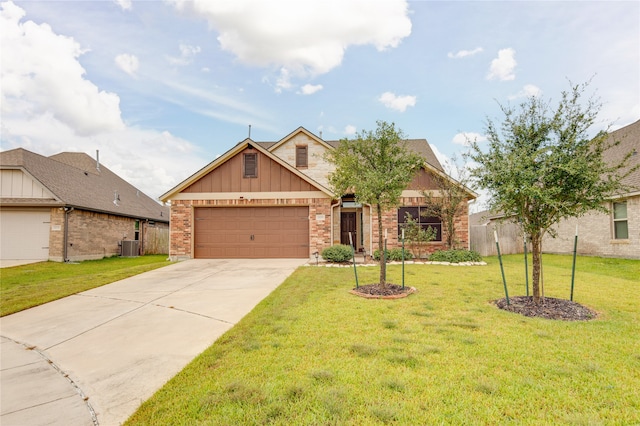 view of front of property featuring a front lawn, central AC unit, and a garage