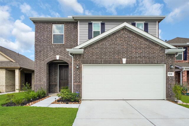 front of property with a garage