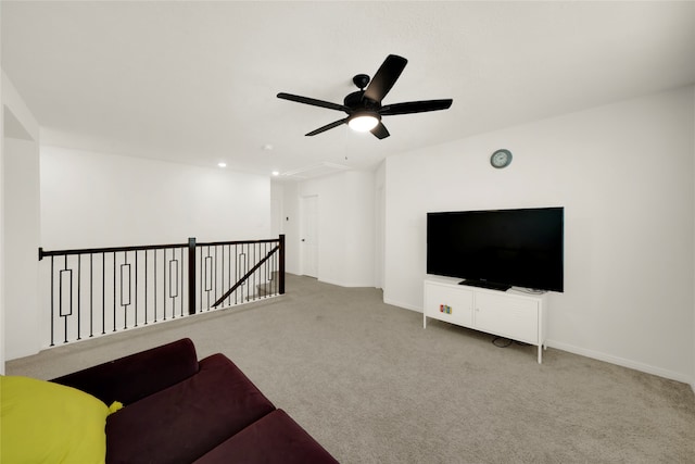 unfurnished living room with light carpet and ceiling fan