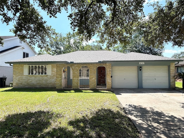 ranch-style house with a front yard and a garage