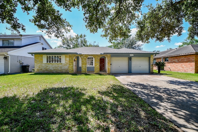 single story home with a front yard and a garage