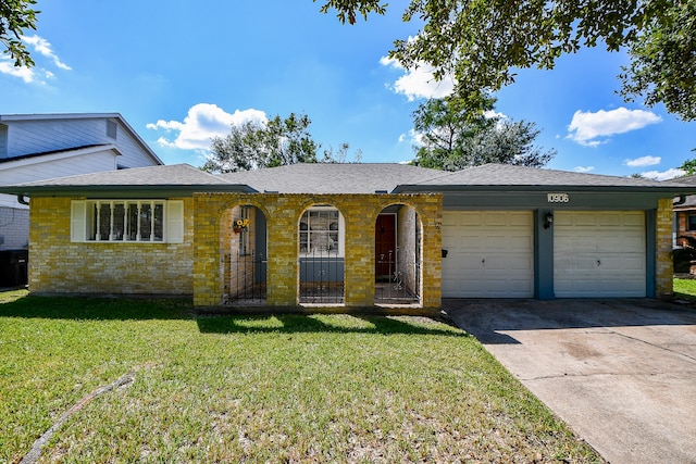 single story home with a front lawn and a garage