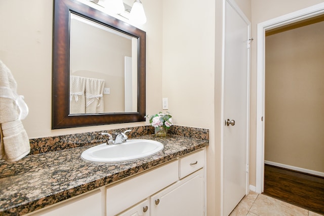 bathroom with vanity and hardwood / wood-style flooring