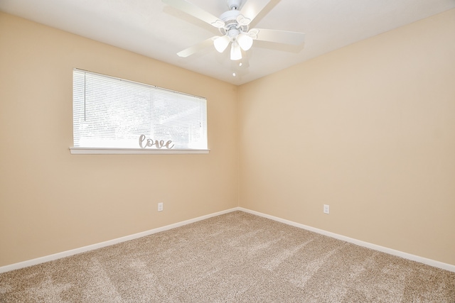 carpeted empty room with ceiling fan