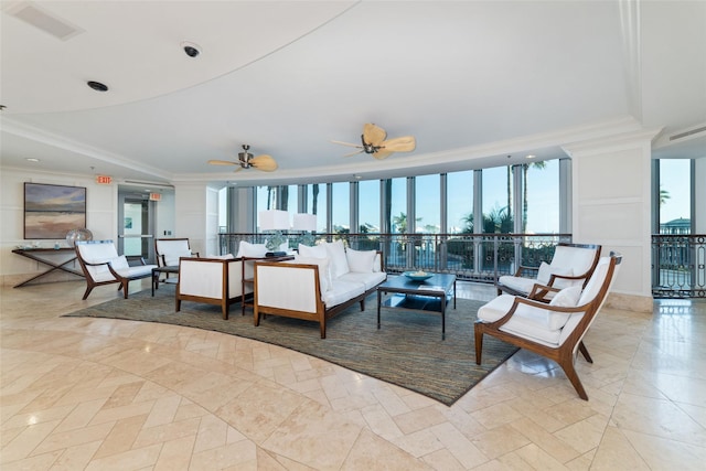 living room featuring crown molding and ceiling fan