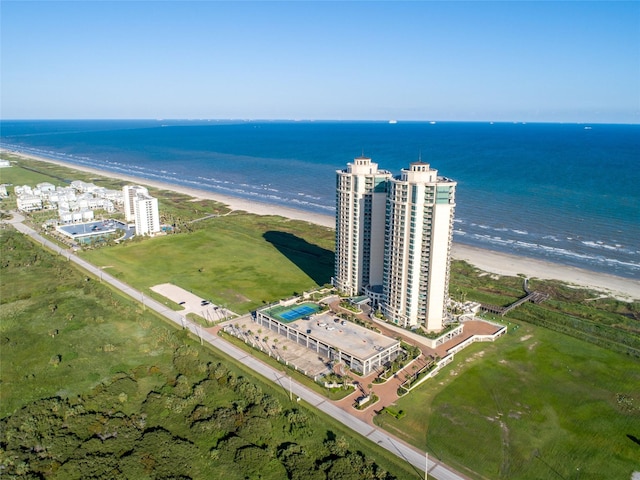 bird's eye view featuring a water view and a beach view