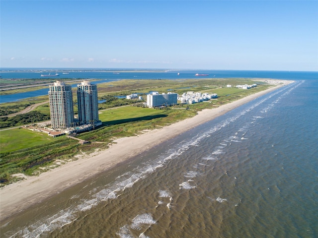 drone / aerial view featuring a view of the beach and a water view