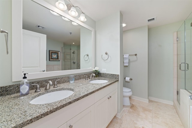 bathroom with tile patterned flooring, toilet, vanity, and a shower with shower door