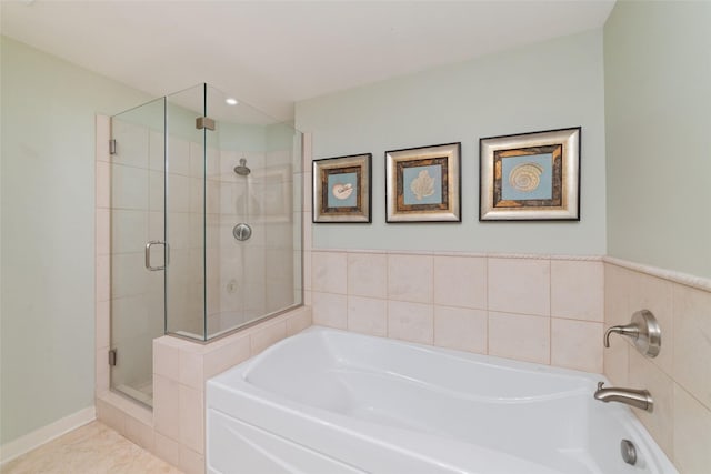 bathroom with tile patterned floors and plus walk in shower