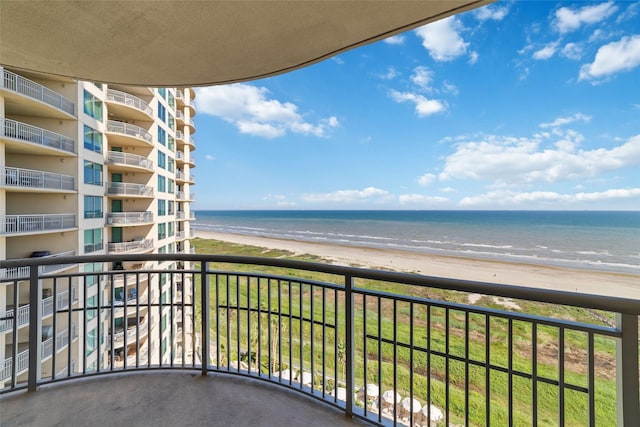 balcony with a view of the beach and a water view