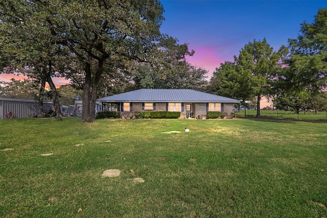 view of yard at dusk