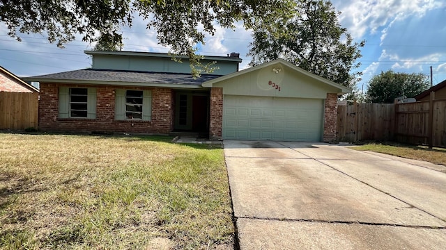 view of front facade with a front yard and a garage