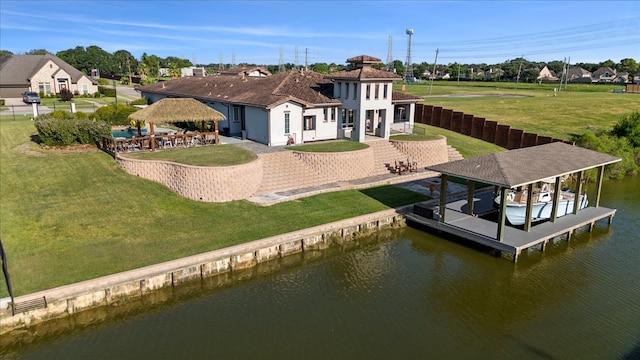 exterior space with a patio, a gazebo, a water view, and a yard