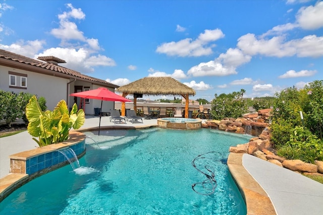 view of swimming pool with a patio, a gazebo, an in ground hot tub, and pool water feature