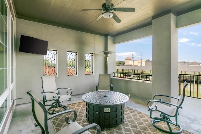 balcony featuring ceiling fan and a patio area