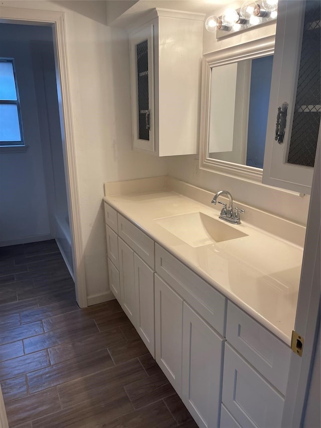 bathroom featuring vanity, walk in shower, and hardwood / wood-style floors