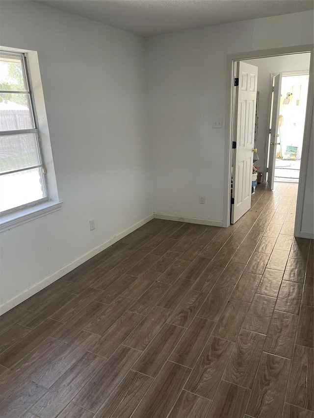 empty room featuring dark hardwood / wood-style floors