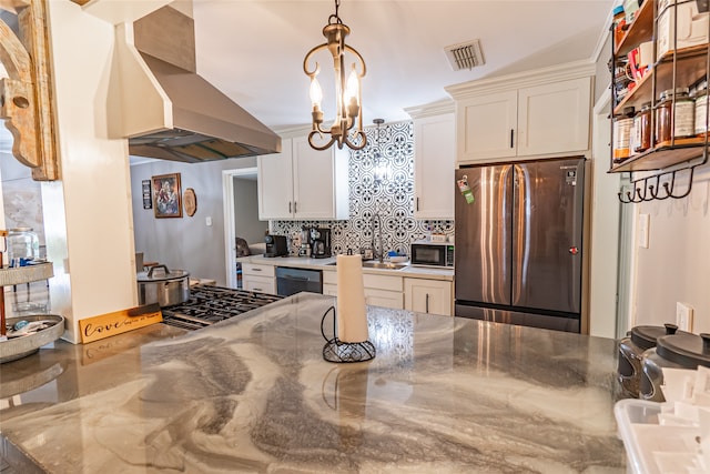 kitchen with white cabinetry, black appliances, tasteful backsplash, wall chimney exhaust hood, and lofted ceiling