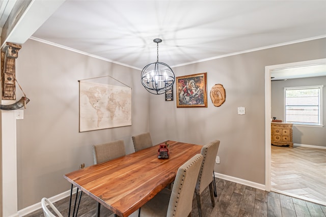 dining room featuring ornamental molding, dark hardwood / wood-style flooring, and a notable chandelier