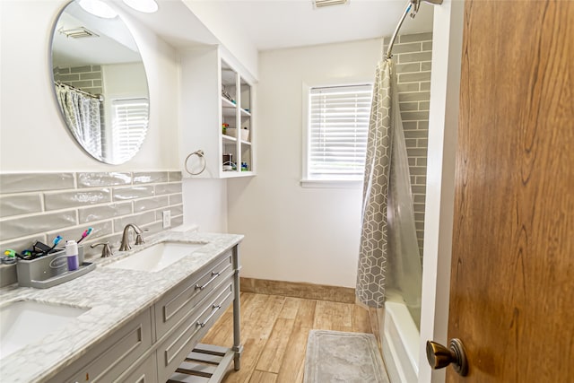 bathroom featuring shower / bath combination with curtain, backsplash, vanity, and hardwood / wood-style floors