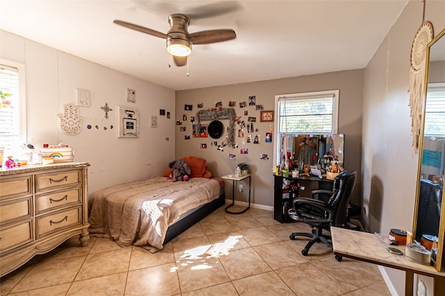 bedroom featuring light tile patterned floors and ceiling fan