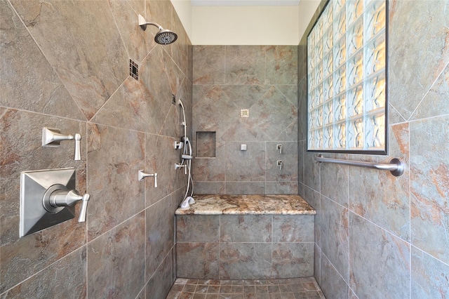 bathroom featuring tiled shower