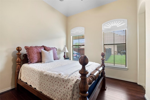 bedroom featuring lofted ceiling and dark wood-type flooring