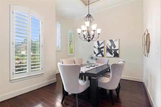 dining area featuring ornamental molding, dark hardwood / wood-style floors, and an inviting chandelier