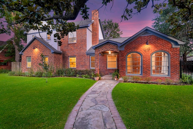 view of front of home with a lawn