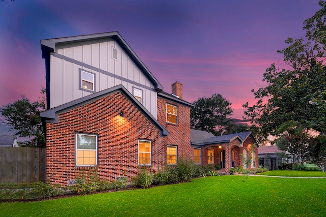 view of front of property with a yard