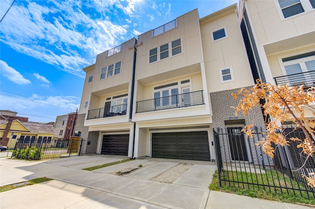 multi unit property featuring a garage