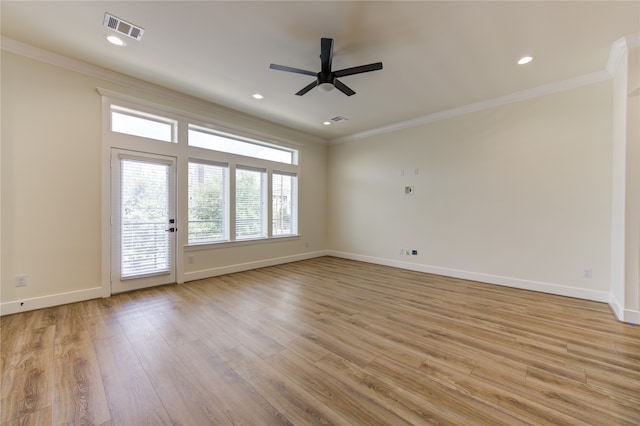 spare room featuring ornamental molding, ceiling fan, and light hardwood / wood-style flooring