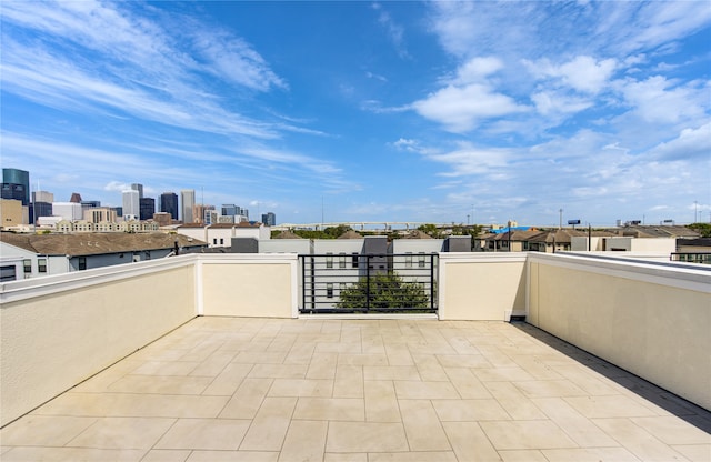 view of patio featuring a balcony