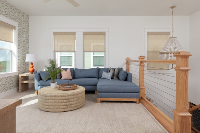 living room featuring carpet and ceiling fan