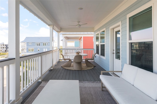 balcony featuring ceiling fan and an outdoor hangout area