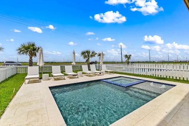 view of swimming pool with an in ground hot tub and a patio area