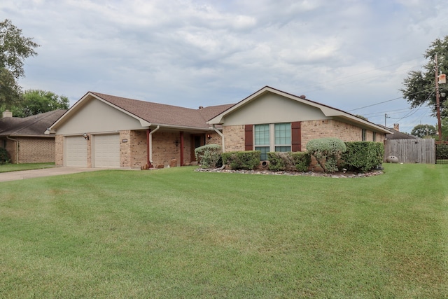 ranch-style house featuring a front lawn and a garage