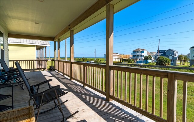 wooden deck featuring a yard