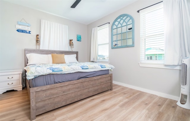 bedroom featuring light hardwood / wood-style flooring and ceiling fan